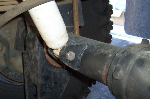 1994 Ford F-150 - Detail of the rear axle and shock absorber assembly on a vehicle.