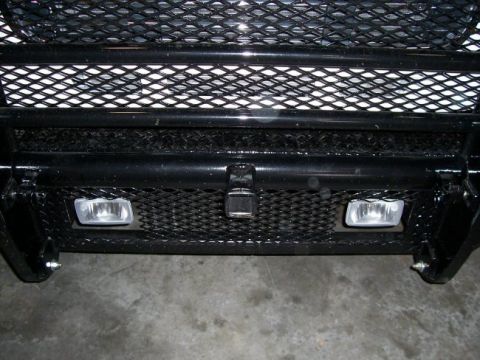 1978 Ford F-250 - Close-up of a truck's front end, showing the grille, bumper, and fog lights.