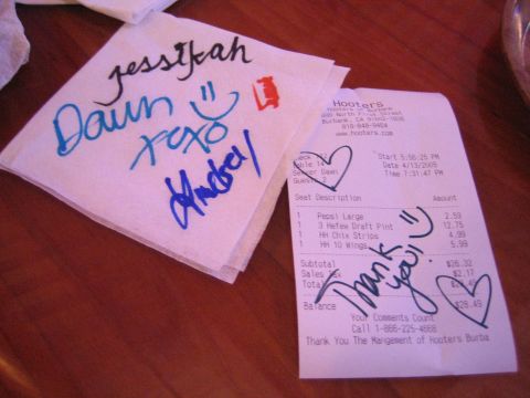 1990 Ford Bronco - Photograph of a restaurant receipt and autographed napkin, not a technical document.