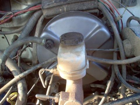 1988 Ford Bronco - Close-up of the brake booster and master cylinder assembly in a 1988 Ford Bronco.