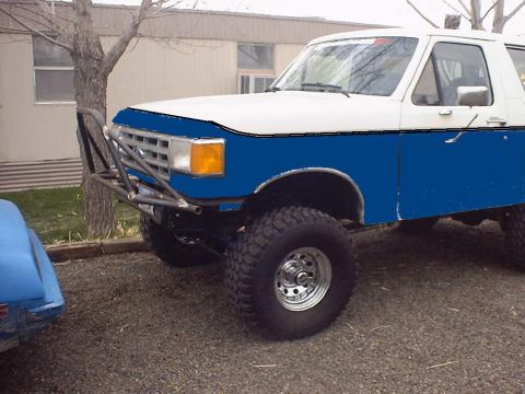 1988 Ford Bronco - This modified Ford Bronco features a custom front bumper and large off-road tires.