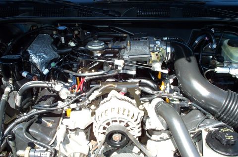 1998 Ford Crown Victoria - The intake spacer and the revised Non-PI intake are visible in this pic .