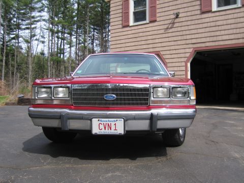 1991 Ford LTD Crown Victoria - Front view of a red Ford Crown Victoria parked in a driveway.