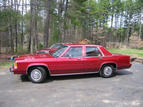 1991 Ford LTD Crown Victoria - This 1991 Ford Crown Victoria LTD is seen from the side, with another vehicle partially visible in the background.