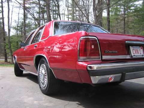 1991 Ford LTD Crown Victoria - Rear view of a red 1991 Ford Crown Victoria LTD sedan.
