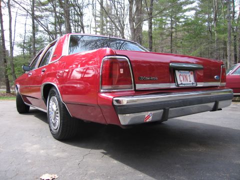 1991 Ford LTD Crown Victoria - Rear view of a red 1991 Ford Crown Victoria LTD parked outdoors.