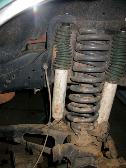 1990 Ford Bronco - Bashed in the same shock on the other side too.