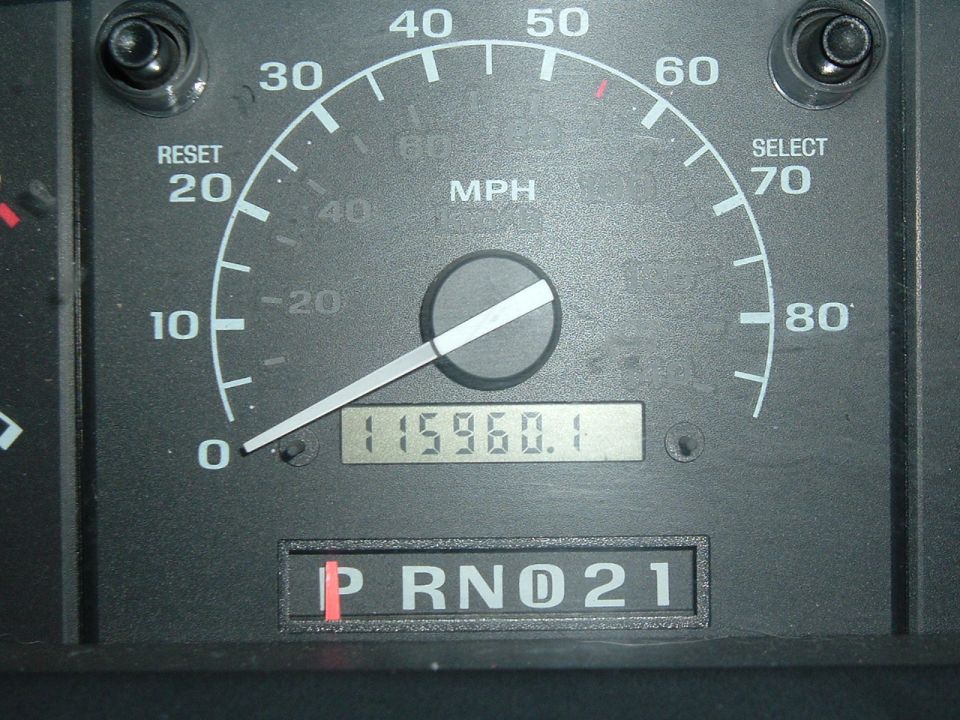 Speedometer showing 0 mph, odometer reading 115960.1, and gear selector in Park