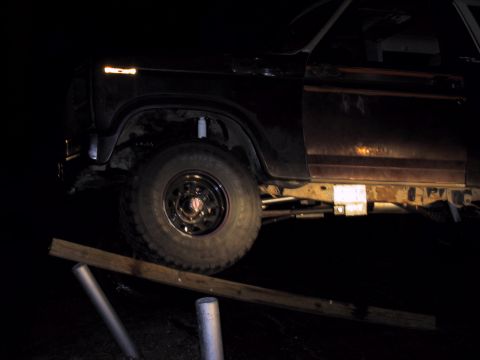 1983 Ford Bronco - Side view of a Ford Bronco, likely from the early 1980s, with visible rust on the frame.