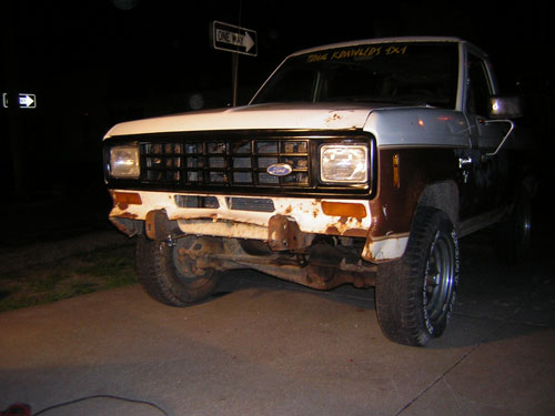 1986 Ford Bronco II front view, showing grille, headlights, and rusty bumper