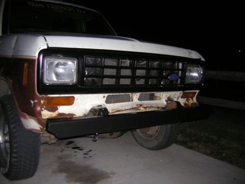 1986 Ford Bronco II - Front view of a 1986 Ford Bronco II showing its grille and bumper, with visible rust.