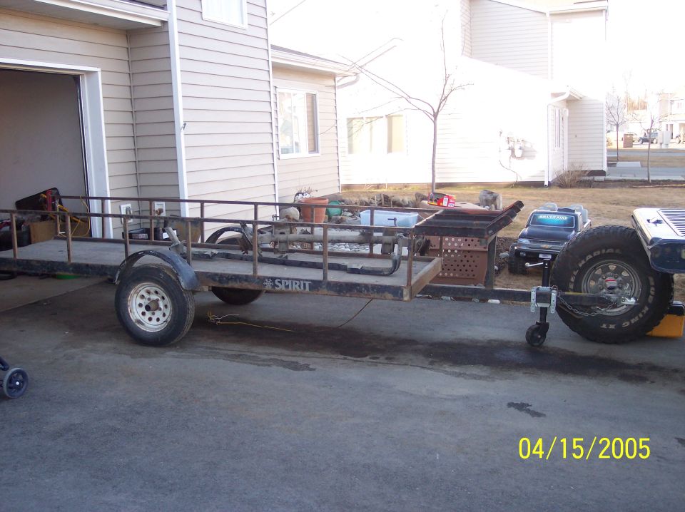 utility trailer with "SPIRIT" on the side, parked in a driveway