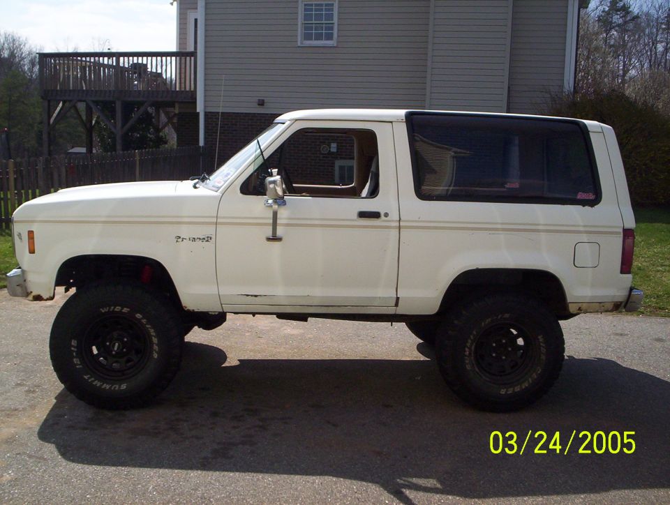 White 1984 Ford Bronco II parked outside a house