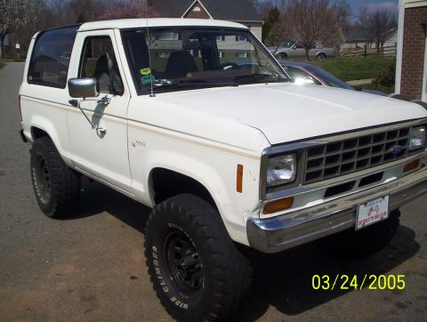 1984 Ford Bronco II - White 1984 Ford Bronco II parked on a residential street.
