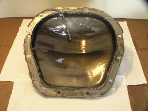 2000 Ford Excursion - Differential cover removed, showing old gasket and fluid residue.