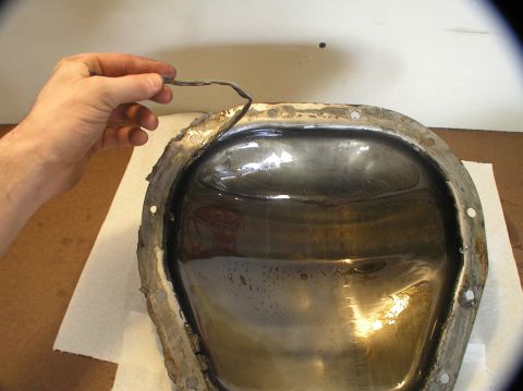 2000 Ford Excursion - Removing the old gasket from a differential cover during fluid replacement.