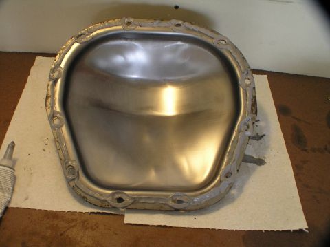2000 Ford Excursion - Differential cover prepared for installation with sealant applied around the bolt holes.