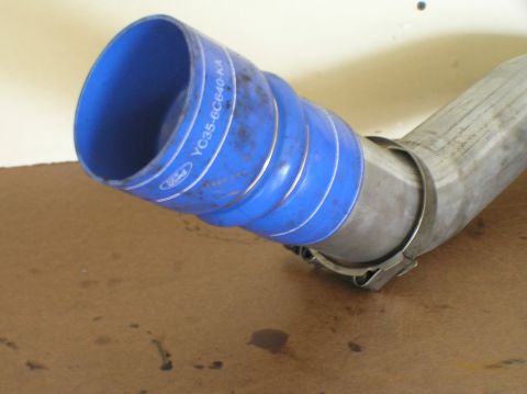 2000 Ford Excursion - Close-up of a blue Ford turbocharger hose with white lettering and a metal clamp.