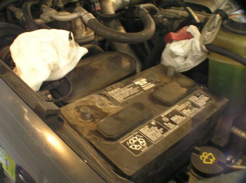 2000 Ford Excursion - Remove the battery cables. Negative first, then positive. Cover them with a rag or paper towel to prevent any contact with other metal, too…