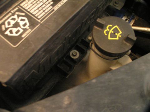 2000 Ford Excursion - Use a 5/16" wrench or socket to remove this bolt that holds the battery in place.