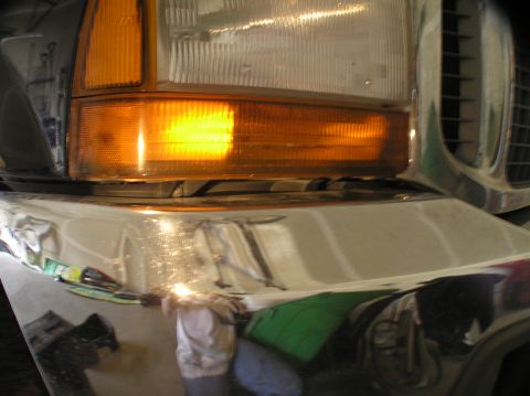 2000 Ford Excursion - The front corner of a large truck, showing the amber turn signal and headlight.