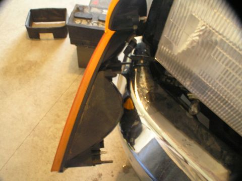 2000 Ford Excursion - The front parking light assembly is shown removed from a 2000 Ford Excursion, likely for bulb replacement.