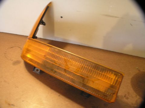 2000 Ford Excursion - This is a close-up of an amber parking light assembly, likely a replacement part.