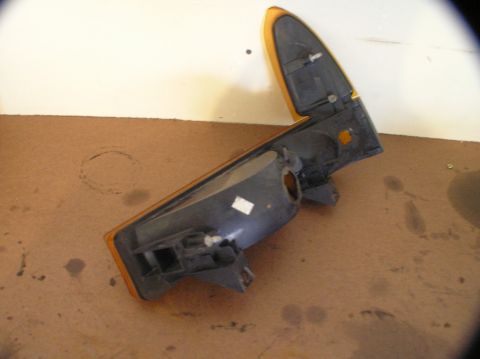 2000 Ford Excursion - A disassembled car parking light assembly is shown, detached from a vehicle.