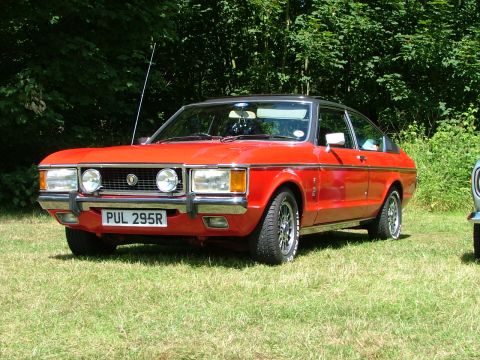 1976 Ford Granada - This 1976 Ford Granada coupe features a distinctive red exterior with a contrasting black roof.