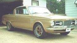 1964 Plymouth Barracuda - 1964 Plymouth Barracuda in tan, showing its distinctive grille and front end.