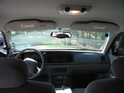 1991 Ford LTD Crown Victoria - Interior view of a car, likely from the early 1990s, with a dashboard and steering wheel.