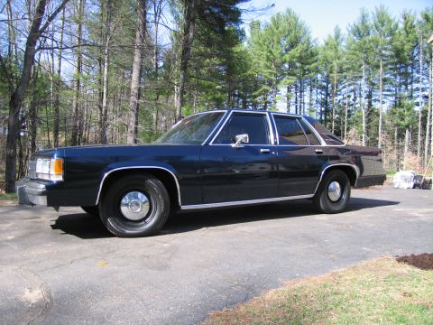 1991 Ford LTD Crown Victoria - This 1991 Ford Crown Victoria LTD is seen from the side, its classic sedan body style.