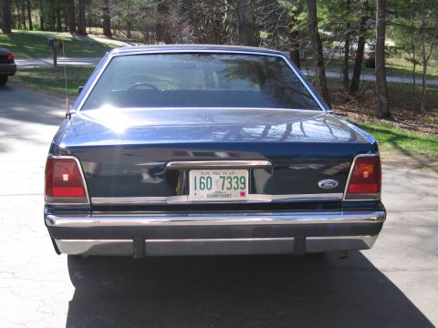 1991 Ford LTD Crown Victoria - Rear view of a 1991 Ford Crown Victoria LTD parked on a driveway.