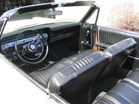 1967 Ford Galaxie - Interior view of a 1967 Ford Galaxie convertible, highlighting the dashboard and seating.