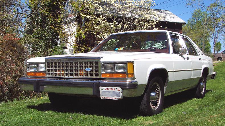 1985 Ford Crown Victoria LTD parked on grass, front 3/4 view. Virginia license plate visible