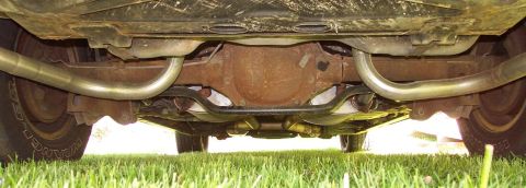 1985 Ford Crown Victoria LTD - Undercarriage view showing the rear axle and dual exhaust system of a vehicle.