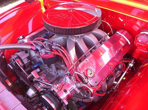 1995 Ford Bronco - A highly customized V8 engine with polished aluminum valve covers and a K&N air filter is shown in detail.