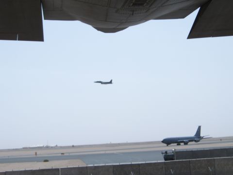1988 Ford Bronco - Two aircraft are visible on an airfield, one on the ground and one in the air.
