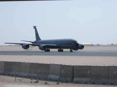 1988 Ford Bronco - A large gray US Air Force tanker aircraft taxis on a desert tarmac under a clear sky.