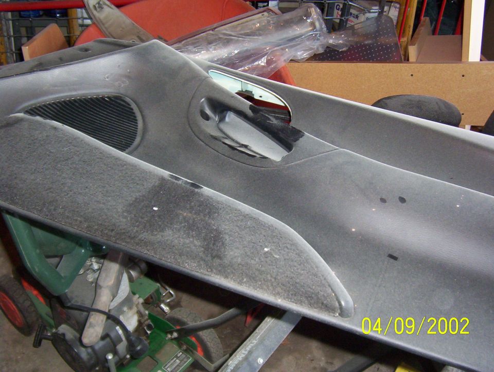dashboard section with speaker grille and vent opening, dusty
