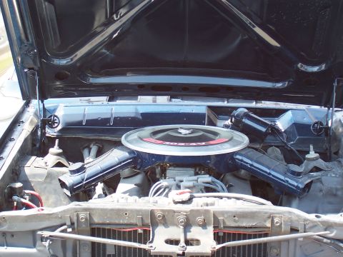 1969 Ford Ranchero - The engine bay of a 1969 Ford Ranchero, its V8 engine and blue air cleaner assembly.