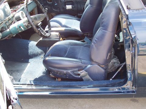 1969 Ford Ranchero - Interior view of a car showing the seats, steering wheel, and dashboard components.