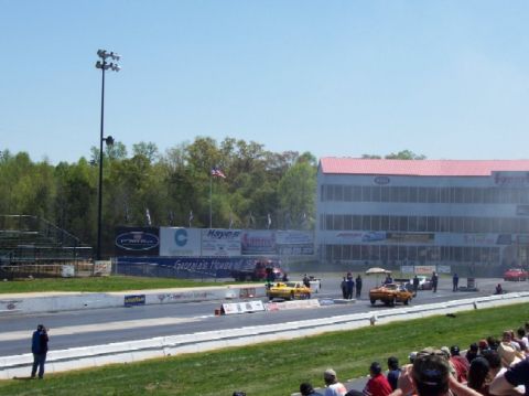 1978 Ford F-250 - Drag racing event with cars on the track and spectators in the stands.