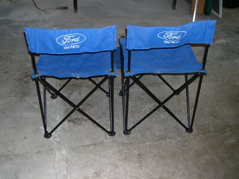 1994 Ford Bronco - Pair of Ford Bronco branded camping chairs shown in a garage setting.