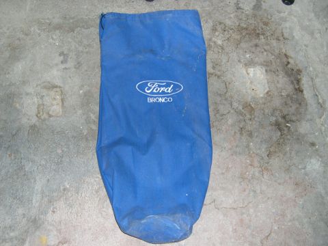 1994 Ford Bronco - A blue bag with the Ford Bronco logo is shown on a concrete surface.