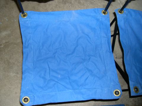 1994 Ford Bronco - Blue canvas tarp with grommets, attached to a black metal frame.