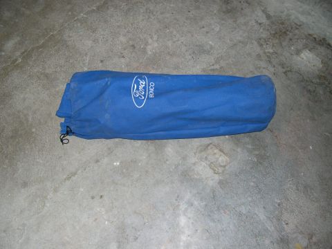 1994 Ford Bronco - A blue car cover with the Ford Bronco logo is shown on a concrete surface.