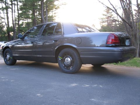 1991 Ford LTD Crown Victoria - This 1991 Ford Crown Victoria LTD is seen from the rear quarter angle, its dark gray exterior.