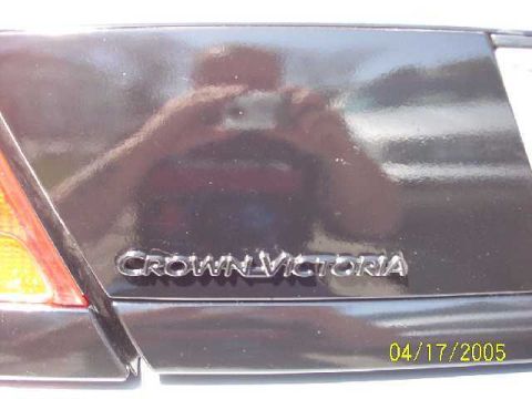 1999 Ford Crown Victoria - The 'Crown Victoria' badge is visible on the rear of the car, along with a date stamp.