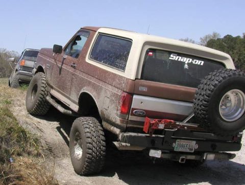 1988 Ford Bronco - CSN.Rebel flexing his six inch suspension lift and thrity-fives.